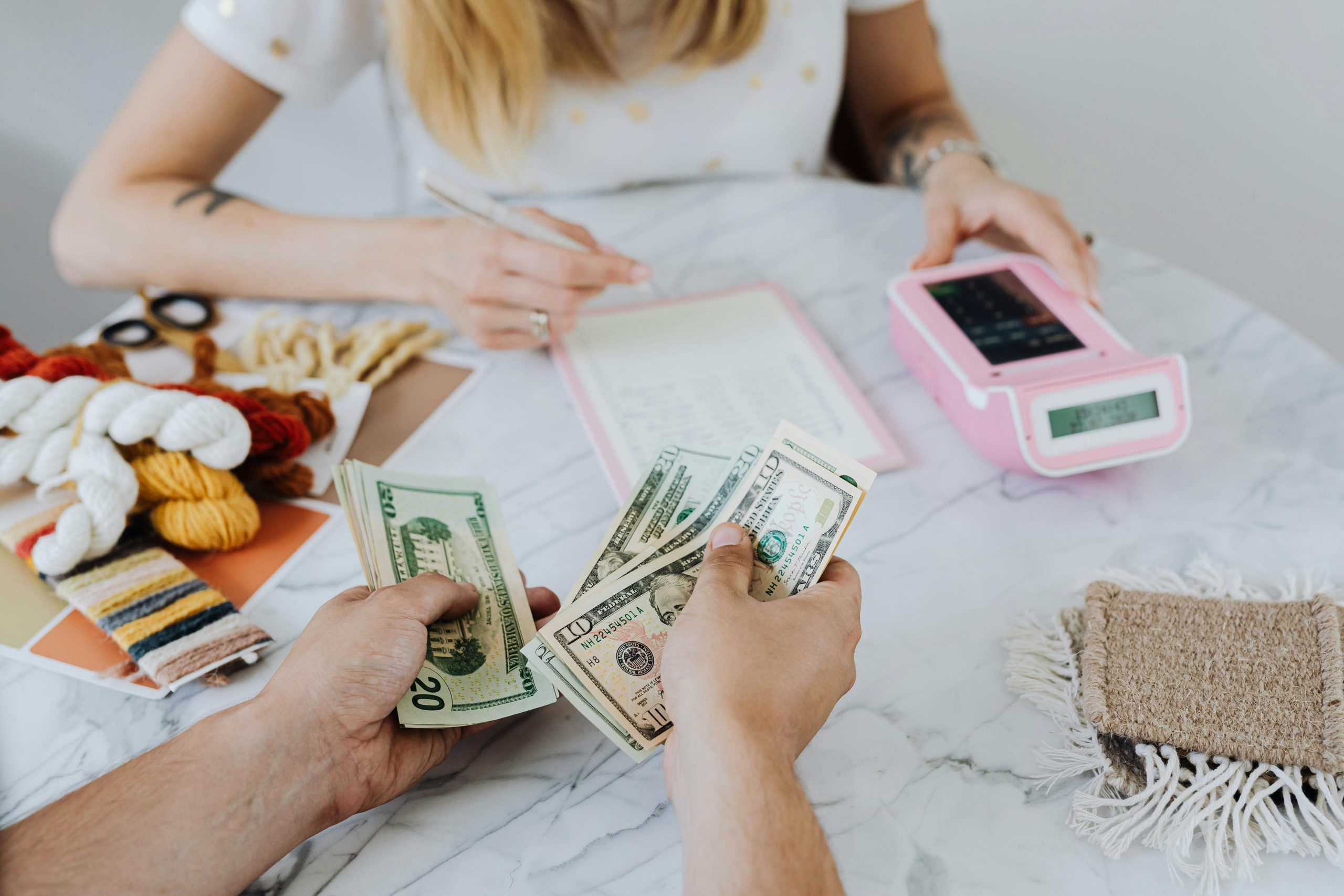 People counting money from craft fair